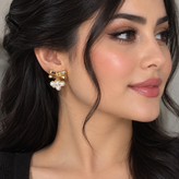 گوشواره زنانه مدل پاپیون و مروارید طلایی استیل
